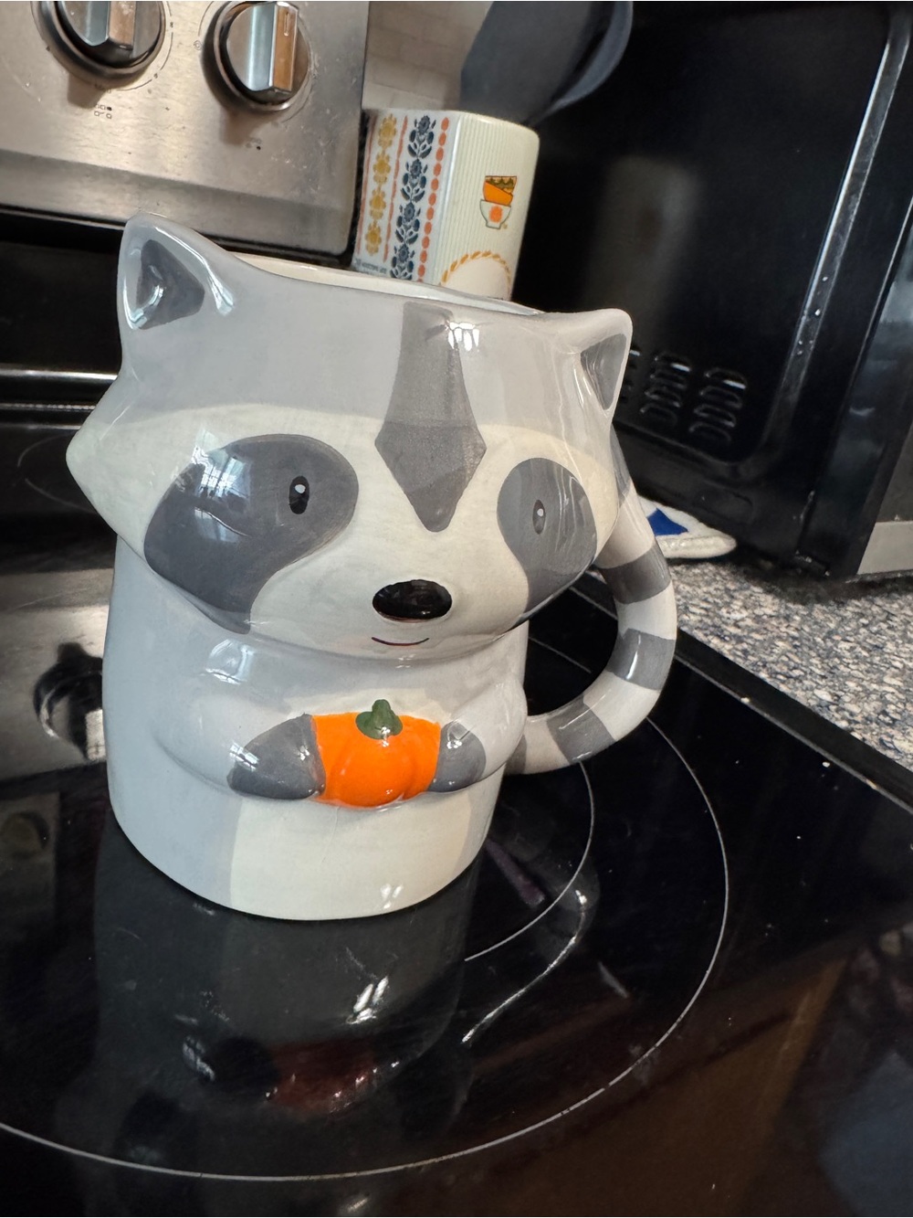 Gray Raccoon Mug with Orange Pumpkin